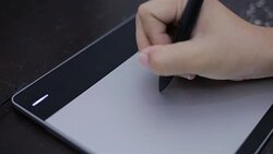 Woman drawing on mouse pad Stock Footage