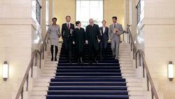 Judges and lawyers walking down stairs in courthouse Stock Footage