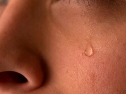 Tear rolling down womans cheek Stock Footage