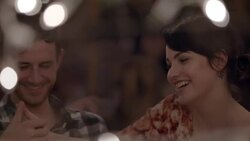 Cute young couple thumb wrestle competitively at Austin bar Stock Footage