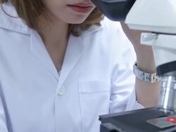 HD : Scientist using microscope Stock Footage