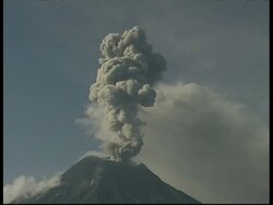 MS grey smoke and ash cloud billow from crater into sky, Mount Tunguragua, Ecuador Stock Footage