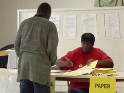 MS, ZO, Man checking in at desk at polling place, Toledo, Ohio, USA Stock Footage