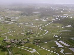 WS AERIAL View over farm fields, Marsh beds / Pais de la Loire, France Stock Footage