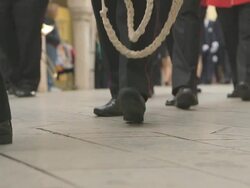 MS Shot of red band starts walking in easter parade AUDIO / Kerkyra, Corfu, Greece Stock Footage