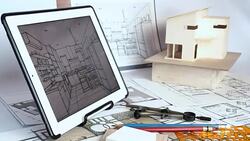 Architect working with house model & blueprints Stock Footage