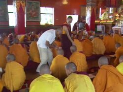 MS ZI PAN Man giving money to young Buddhist monks with guidance of monk / Kathmandu, Central, Nepal Stock Footage