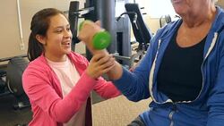 Senior man works out with personal trainer Stock Footage