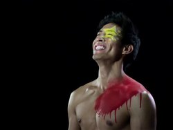 Man with Chinese flag painted on face and chest, laughing Stock Footage