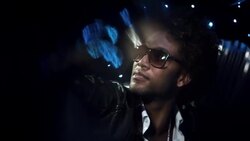 Hip-hop star stares out at paparazzi from limousine and turns to face camera at awards show Stock Footage