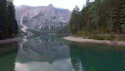 Aerial shot flying over a mountain lake Stock Footage