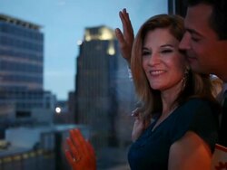 MS Middle aged couple sitting together at window of urban hotel room looking out with wonder / Minneapolis, Minnesota, United States Stock Footage