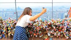 Happy Asian woman taking photo at n seoul tower Stock Footage