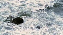 Rocks and surf real time 1 Stock Footage