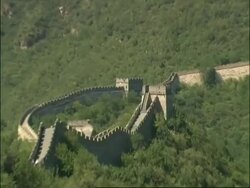 WA Great Wall of China snaking up hillside, zoom in to staircase in parapet, zooms out to WA, Mutianyu, China Stock Footage