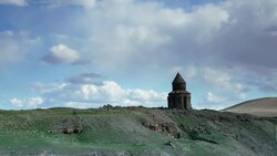 Time-lapse of old Armenian church ruin in Eastern Anatolian landscape with clouds passing by. Stock Footage