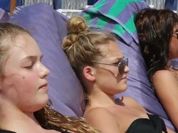 MS SLO MO Teenage girls sunbaking / Padang Padang, Bali, Indonesia Stock Footage