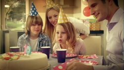 SLO MO birthday girl blowing out candles for tenth birthday Stock Footage