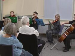 HD DOLLY: Seniors Listening To Young Musicians Stock Footage