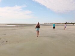 MS TS Shot of mother and baby walking on beach / St. Simons Island, Georgia, United States Stock Footage