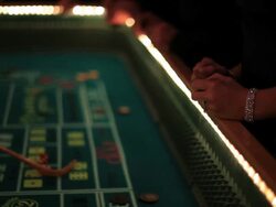 Casino footage, gambling chips and dice on craps table Stock Footage