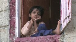 Child looking at from an open window, Karachi Stock Footage