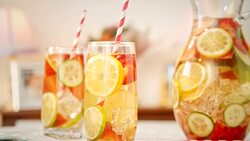 Infused Water with Fresh Strawberries, Lime, Lemon and Basil Stock Footage