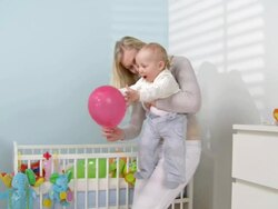 HD CRANE: Mother Playing With Her Baby Stock Footage