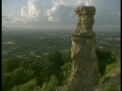 WA high angle, Devils Chimney Limestone Tower, Gloucestershire looking across to Cheltenham town Stock Footage