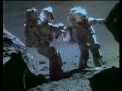Astronauts, Schmitt and Cernan collecting samples between two boulders, Moon Stock Footage