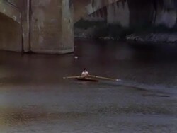 Rowing on the Arno River by Ponte Vecchio #1 Stock Footage