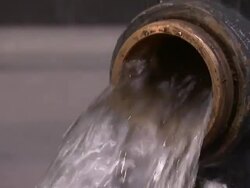 Water pours from an open fire hydrant. Stock Footage