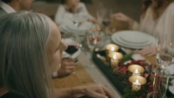 Family sitting on the table for christmas dinner. Stock Footage