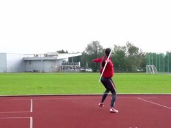 HD: Slo-Mo Shot of Young Woman Throwing Javelin Stock Footage