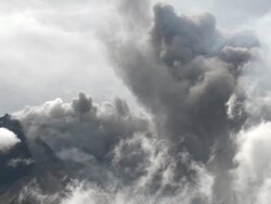Wide shot of eruption at Merapi volcano; Central Java, Indonesia. 29 October 2010 Stock Footage