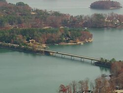 MS AERIAL Shot of cars crossing bridge over lake Keowee / South Carolina, United States Stock Footage