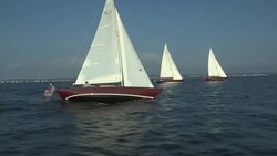 Three red sailboats sail in tandem in Narragansett Bay. Stock Footage