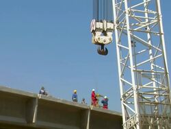 WS LA Workers working at deconstruction of bridge over river Mosel / Wellen, Rhineland Palatinate, Germany Stock Footage