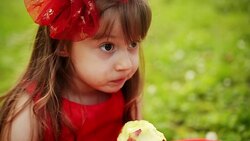 Girl eating apple Stock Footage