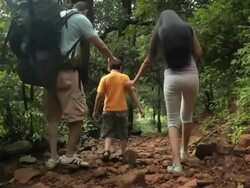 Family tracking in a forest, Malshej Ghat, Maharashtra, India Stock Footage