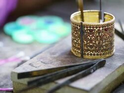 Goldsmith Jeweler decorating gold Stock Footage