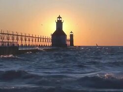 Sun Setting Behind Lighthouse Part 9 Stock Footage