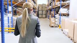Woman walking in storage room Stock Footage