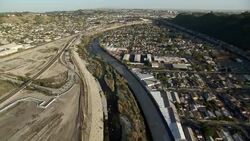 Aerial view of the Los Angeles River in East Los Angeles, California. Stock Footage