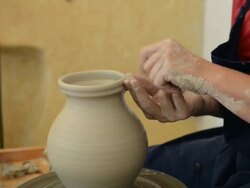 MS Shot of female potter makes pitcher one spout / Landshut, Bavaria, Germany Stock Footage