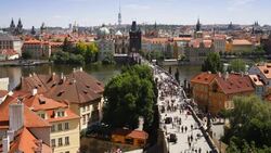 Pedestrians cross the famous Charles Bridge in Prague. Stock Footage
