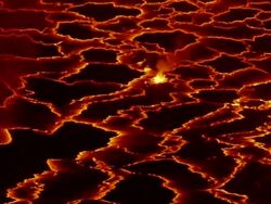 MS Shot of Molten rock cools and forms plates on surface of lava lake / Goma, Virunga National Park, Democratic Republic of the Congo Stock Footage