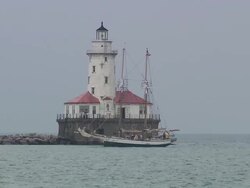 Tall Ship Driving Past Lighthouse During Festival Stock Footage