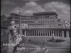 1950: VATICAN CITY: HA WS Piazza Di Pietra (St. Peter's Square) w/ obelisk, fountain & curved colonnade topped w/ statues of saints. WS (BEHIND) Jesus Christ & Apostle statues on roof edge. Religious Icon, Icons, Christian, Catholic, Holy See. Instructional Video