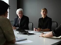 MS group of coworkers in discussion in conference room  Stock Footage